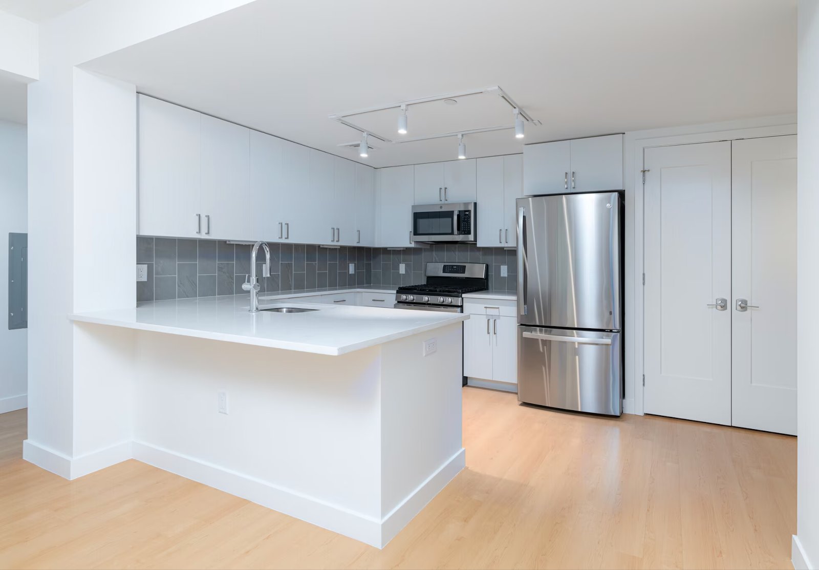 Same sample kitchen, move-out condition, no people